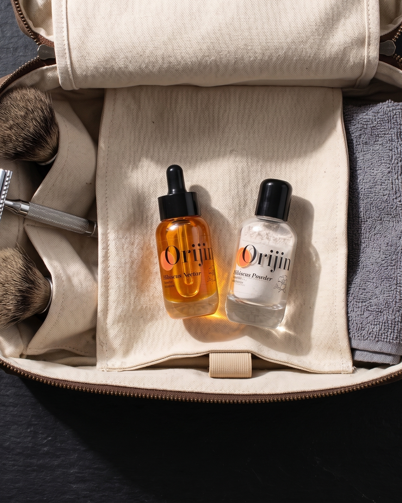 Grooming kit with bottles, towels, and tools on a dark surface