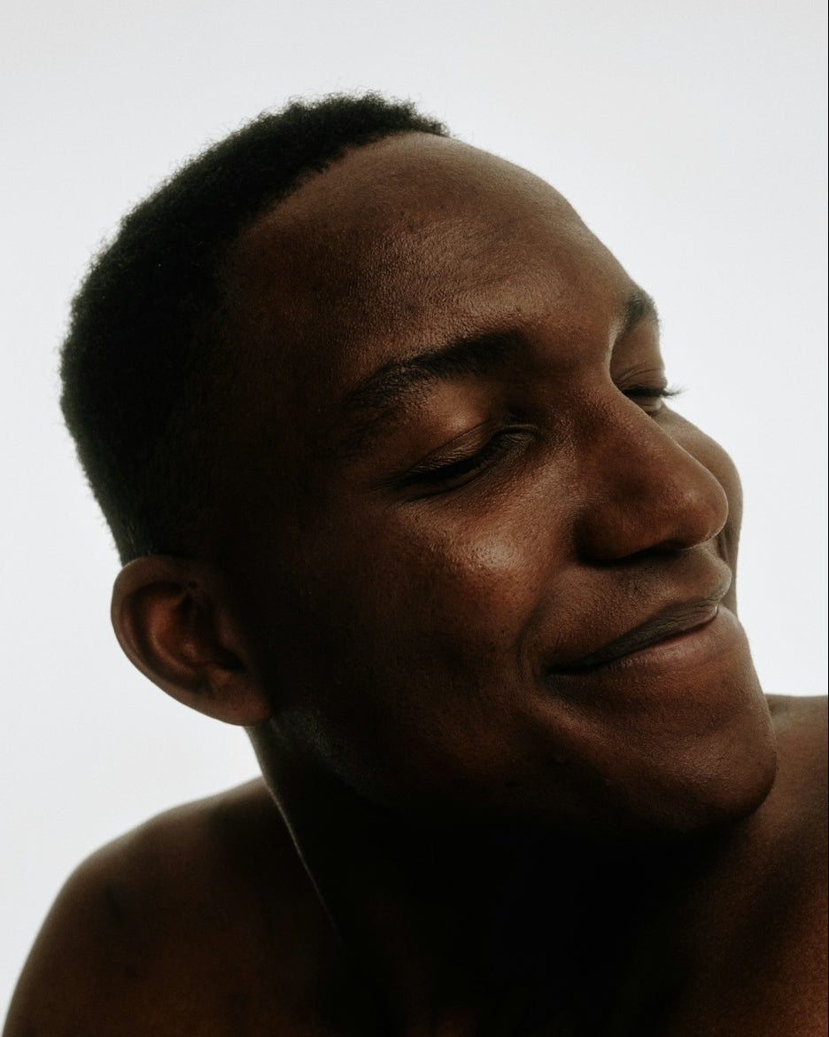 Man smiling with a white background